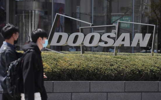 Doosan to raise W1tr by selling shares, assets