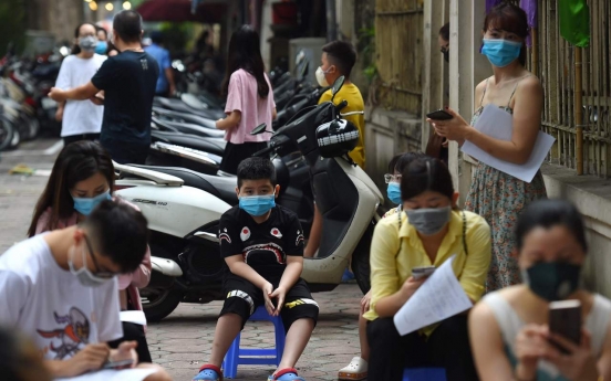 Vietnam reports 1st ever virus death after renewed outbreak