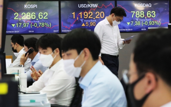 Seoul stocks open nearly flat amid soaring virus cases