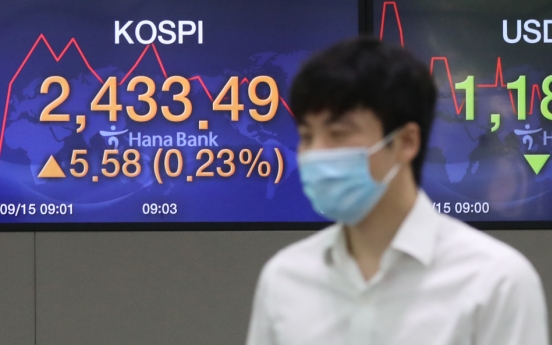 Seoul stocks open tad higher on brisk M&As, vaccine hopes