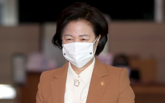 Justice minister apologizes over massive virus outbreak at detention center