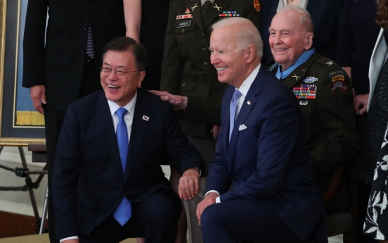 Biden goes maskless in meeting with Moon