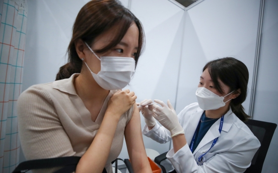 Moon says vaccinations 'faster than expected' as half of population gets first shots