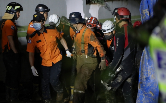 2 rescued, 7 dead from submerged parking garage in Pohang