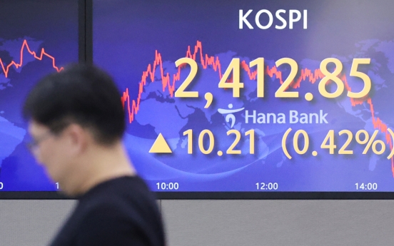 Seoul shares open higher on eased banking woes