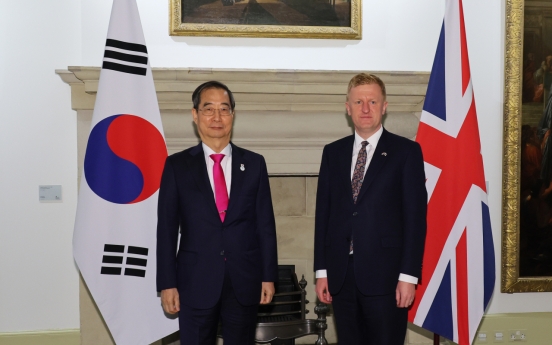 Prime Minister Han meets with Britain's deputy prime minister in London