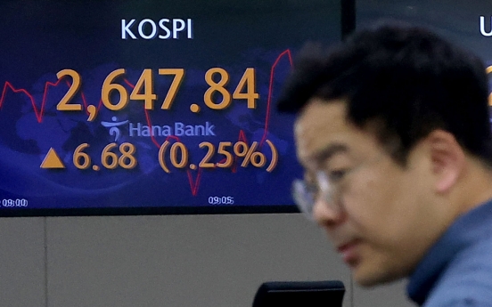 Seoul shares open tad higher ahead of Fed meeting