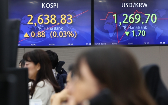 Seoul shares open tad lower ahead of Fed's rate decision