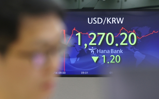 Seoul shares end lower ahead of Fed's rate decision