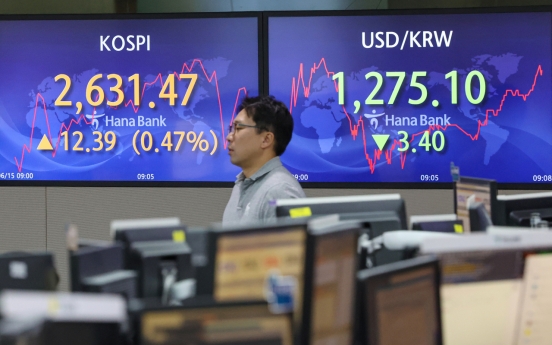 Seoul shares open higher after Fed rate pause