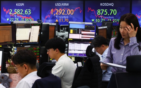 Seoul shares down for third day ahead of Powell's testimony