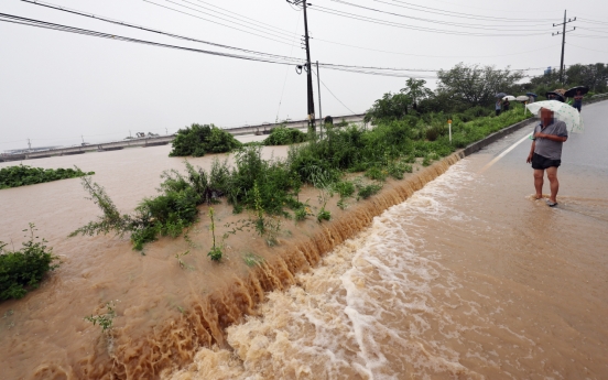 At least 22 dead, 14 missing, as torrential rains batter Korea