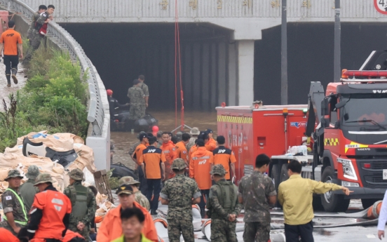 49 dead or missing in downpour after 4 more bodies recovered from tunnel