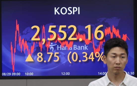 Seoul shares end higher ahead of key economic data