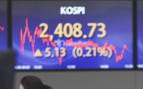 Seoul shares close tad higher ahead of key US jobs data