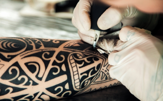 Government begins research on legalizing nonmedical tattooists
