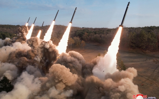 NK leader guides firing drills involving super-large multiple rocket launchers