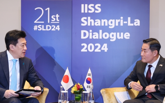 South Korea, Japan defense chiefs agree to put past behind them at Singapore meeting