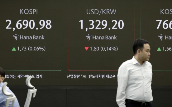 Seoul shares open tad higher on tech, auto gains