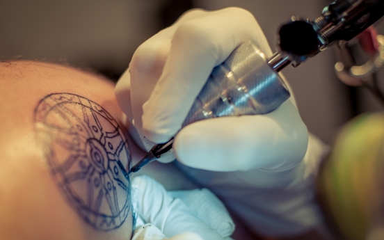 Tattoo artist calls for all body inking to be legal at audit