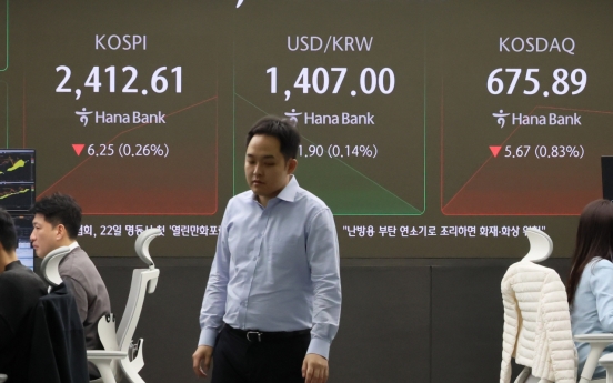 Seoul shares open lower as Fed hints at slowing rate cut