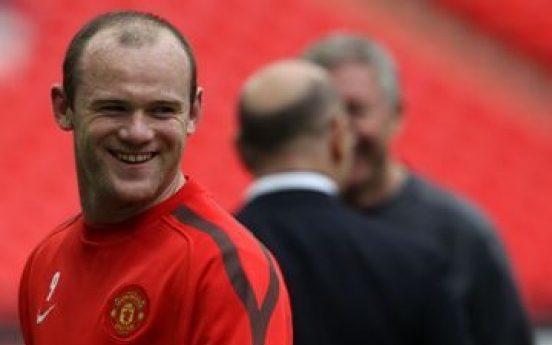 Rooney delighted with hair transplant