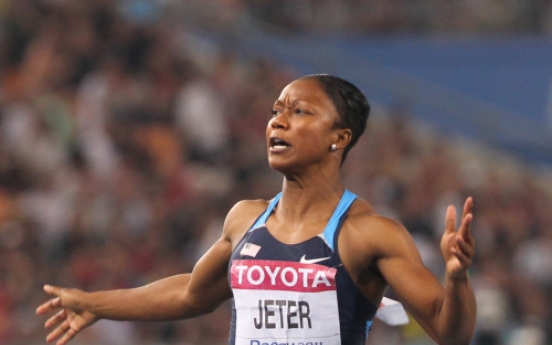American Jeter wins world women's 100m gold