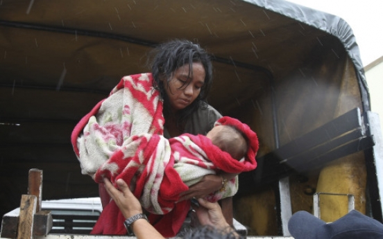 Typhoon floods Manila; thousands evacuated, 7 dead