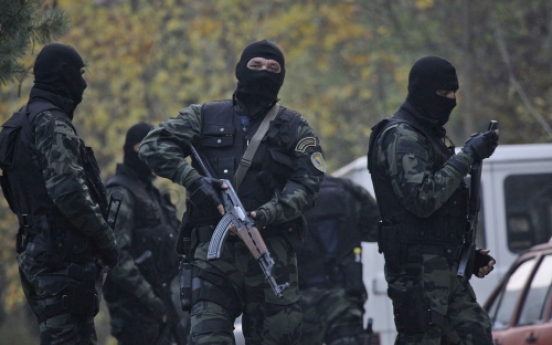Bosnian, Serbian forces raid homes after U.S. embassy attack