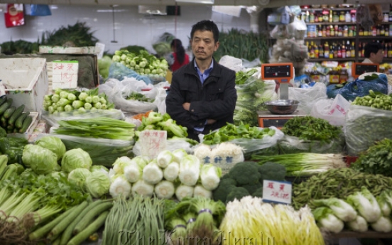 China’s inflation falls as food prices cool