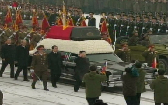 Heir leads funeral for late leader
