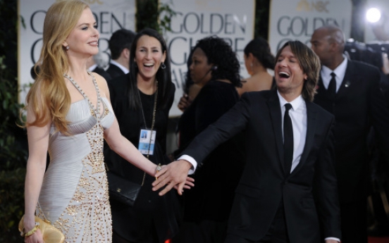Dressed-up stars arrive for glitzy Golden Globes