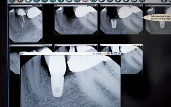 More people take longer-lasting options to replace missing teeth