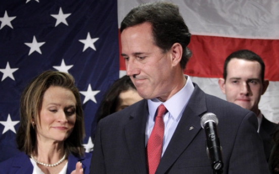 Santorum quits race, handing Romney Republican crown