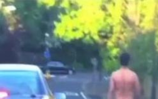 Naked man witnessed cruising down street