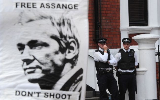U.K., Ecuador seek solution on Assange