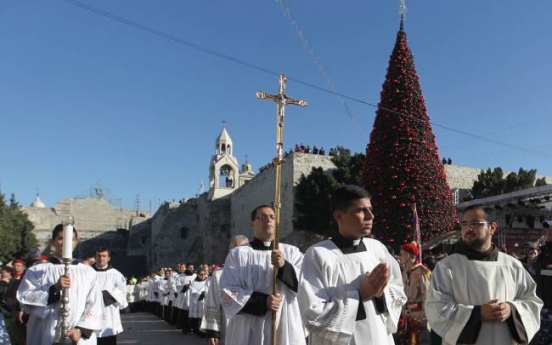 Crowds throng Bethlehem for Christmas