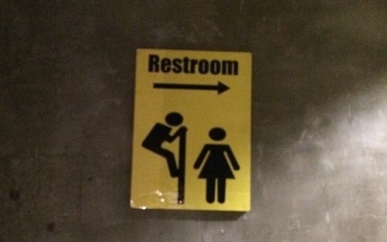 Voyeuristic public toilet signs in Seoul stir controversy