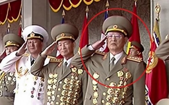 NK leader skips handshake with ex-spy chief at military parade, footage shows