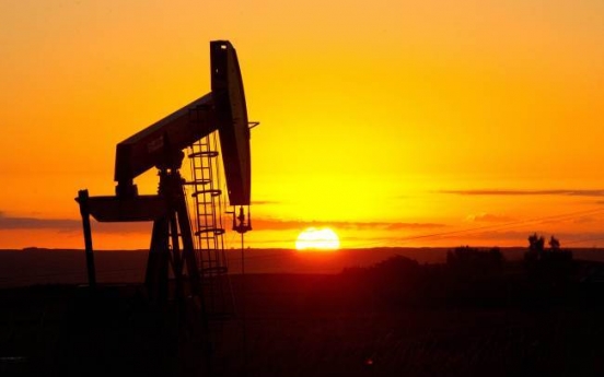 Crude oil slump casts shadow on monetary tightening
