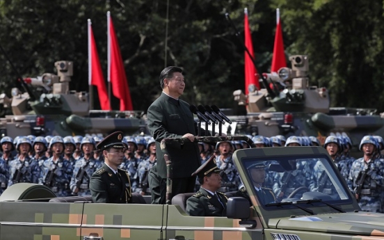Massive military parade for Xi as Hong Kong activists freed