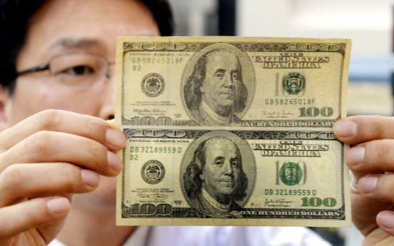 [Photo News] Snuffing out counterfeit currency