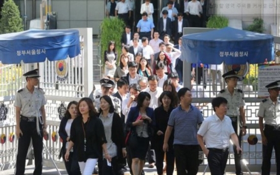 Korean public servants work up to 1,000 hours more than their OECD counterparts a year