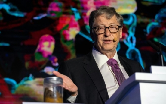 Poop in hand, Bill Gates backs China's toilet revolution