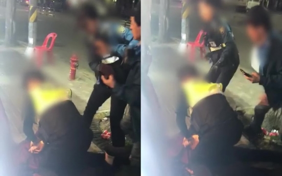 [Newsmaker] Video footage of female cop controlling drunkard sparks dispute