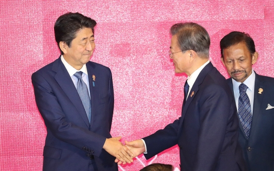 Moon to hold bilateral summit with Abe in China next week