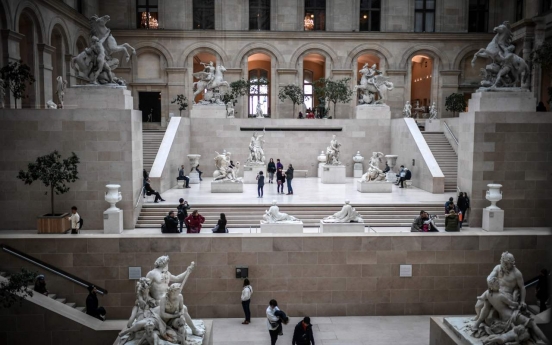France closes Louvre as virus cases mount in Europe