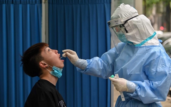 Fresh test for Wuhan as cluster sparks mass virus screening