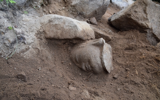 Missing head of Buddha statue on Namsan in Gyeongju discovered