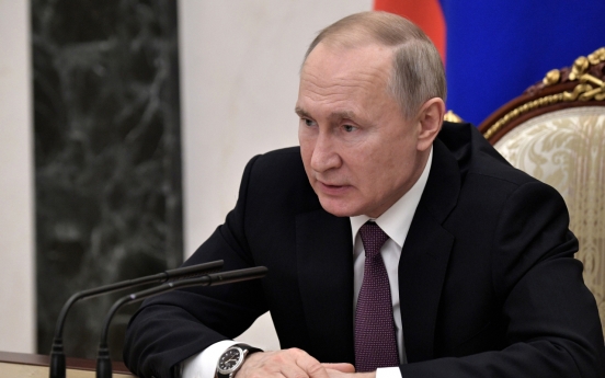 Putin orders massive snap military drills